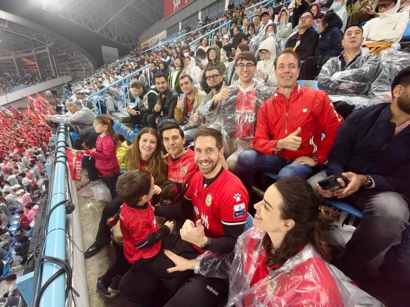 Carlos Lorite watches the opening match of Su Super League with his family and friends, April 11, 2026. Xinhua Carlos Lorite watches the opening match of Su Super League with his family and friends, April 11, 2026. Xinhua